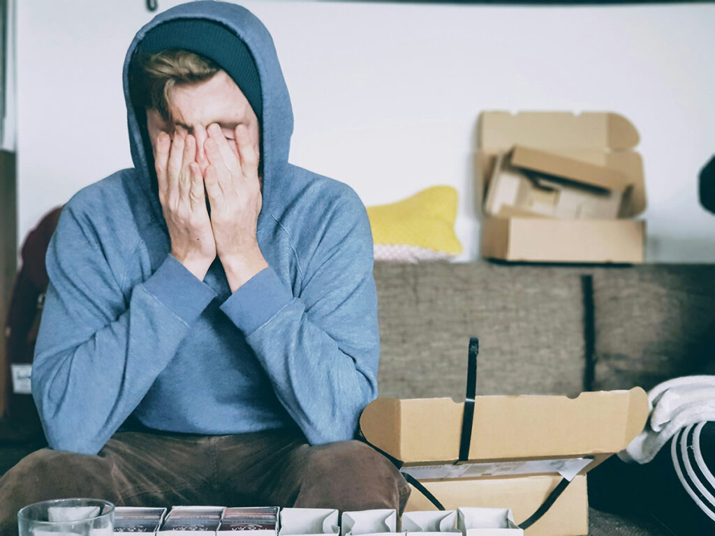 a man looking stressed sitting at a table